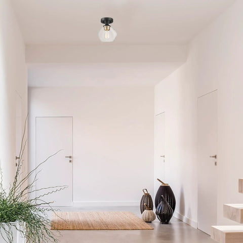 Harrow 1 Light Semi-Flush Mount Ceiling Light With Matte Black Finish, Gold Accent Socket, Clear Glass Shade, installed in a hallway