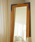 Wooden mirror frame with Four Piece L Shaped Corner Brackets Set In Black Carbon Steel For Sliding Barn Doors And Farmhouse Decor.