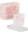 Premium Recloseable Fastener Tape Strips One By Two Inch Clear Heavy Duty Adhesive Pad Ten Pack stacked and displayed.