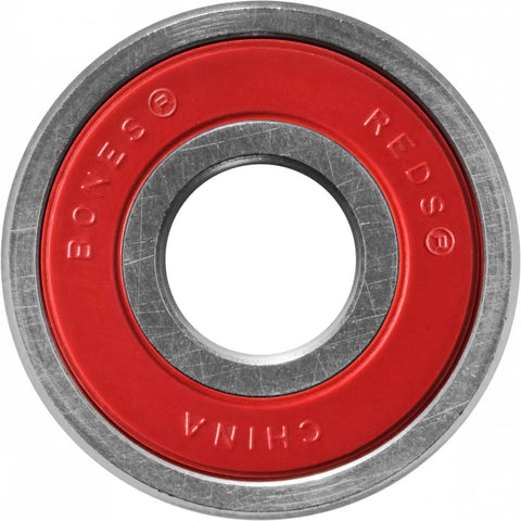 Bones Reds skateboard bearing with red seal and metal outer race, front view