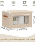 Beige fabric storage bin with handle and clear front window.