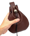 Hand holding a Badass Brown Leather Belt Pouch For Medieval Renaissance And Viking Larp Cosplay, showing drawstring closure.