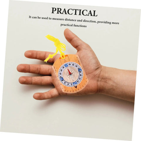 Trail Ready Orienteering Compass With Multi Function Built In Ruler Pointer And Luminous North in a hand, shown close up.