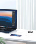 Slick Flush Mount Desk Power Hub With Two AC Outlets And Four Quick Charge Ports Including Dual PD 20W Type C Plugs on white desk.