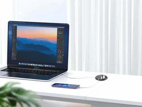 Slick Flush Mount Desk Power Hub With Two AC Outlets And Four Quick Charge Ports Including Dual PD 20W Type C Plugs on white desk.