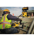 Worker using Pro Grade SDS Max Hollow Drill Bit 7 by 8 Inch with Dust Shroud, efficient dust removal in concrete drilling site
