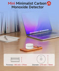 Smart Carbon Monoxide Detector With Matter Thread Real Time Alerts UL 2034 5th Edition Certified on desk near laptop