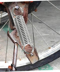 Eight Pieces Extended Compression Spring Assortment Kit For Electric Vehicle Stands Ladder Foot Supports With Heavy Duty Stainless Steel Build For Reliable Structure And Smooth Easy Use In Garage Or Home Projects. installed on a bicycle stand