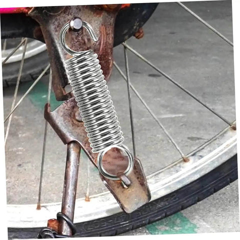 Eight Pieces Extended Compression Spring Assortment Kit For Electric Vehicle Stands Ladder Foot Supports With Heavy Duty Stainless Steel Build For Reliable Structure And Smooth Easy Use In Garage Or Home Projects. installed on a bicycle stand
