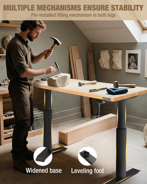Man using Beefy Adjustable Standing Workbench with crank handle and rubber wood top for carving in workshop.