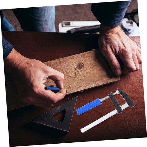 Person using Four Pack Woodworking Clamps Durable Spring Fixing Tools With Beefy Grip on wooden board for DIY projects