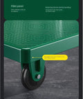Heavy Duty Folding Platform Cart With Push Handle Built Like A Workhorse For Hauling And Loading Anti Slip Deck Quiet Wheels Easy Fold Ideal For Warehouse Garage And Workshop Transport, green anti-slip corner wheel close-up