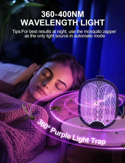 Electric Fly Swatter Bug Zapper Racket with 4000V power and purple light trap next to a sleeping person indoors