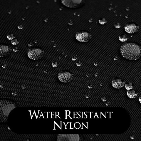 Close-up of water resistant nylon with droplets, showcasing Sleek Black Barber Jacket With Zippered Front And Contrast Pockets Xl Nylon Short Sleeve Top For Salons Boss Level Durability That Keeps You Fresh While Serving Clients With Serious Drip And Top Shelf Quality Daily.