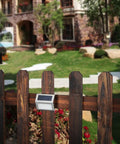 Outdoor Solar Deck Lights Pack Of 6, Waterproof Stainless Steel installed on garden fence