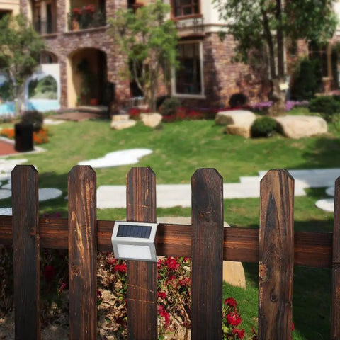 Outdoor Solar Deck Lights Pack Of 6, Waterproof Stainless Steel installed on garden fence