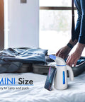 Portable Clothes Steamer For Wrinkle Removal Easy To Use Handheld Travel Steam Iron 700W Power 240ml Big Capacity next to suitcase