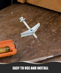 30 Pack Heavy Duty Carbon Steel Drywall Anchors With No Fuss Install Mushroom Petal Expansion Screws on a wooden surface.
