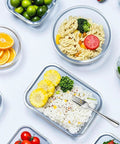 12 Pack Glass Food Storage Containers Set With Airtight Lids Borosilicate Glass Meal Prep Containers filled with meals on white surface