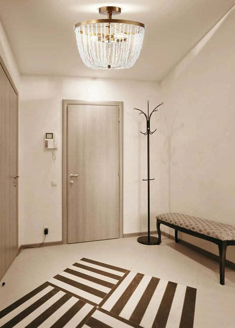 Antique Gold 3 Light Flush Mount Chandelier With Quartz Bead Accents in modern foyer setting