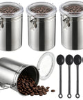 Heavy Duty Stainless Steel Canisters With Airtight Lock Buckles holding coffee beans, and black measuring spoons for storage.