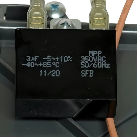 Close-up of black MPP run capacitor, 3uF, 350VAC, with orange lead