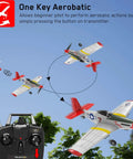 Remote Control Warbird Plane With Four Channel Flight For Outdoors Ready To Fly RTF performing aerobatics with controller.
