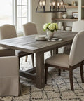 Heritage Gray Reactive Water Based VOC Free Interior Wood Stain 55 Gallon Tank on rustic dining table with beige chairs.