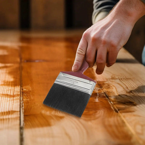 Hand applying stain with All Purpose Paint Brush Set For Walls Ceilings Furniture Decks And Wood Fences Large Flat And Angled Brushes Stain