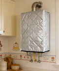 Outdoor Tankless Water Heater Cover With Weatherproof Protection IPX4 Waterproof Rating in indoor setting, quilted silver design