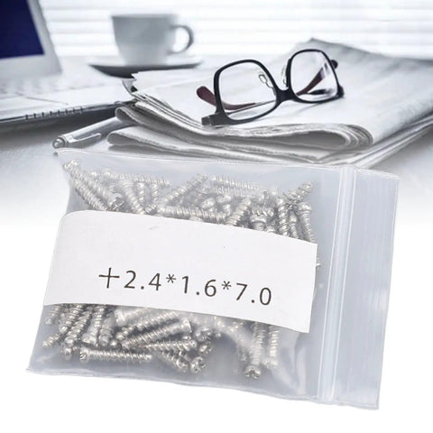 Durable Eyeglasses Hinge Screws Kit For Quick Fixes, Metal Repair Pins in a plastic bag on desk with eyeglasses.