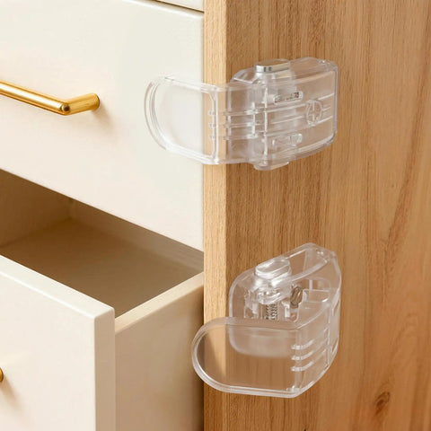 Six Pack Clear Baby Drawer Locks Zero Sweat Install for thin drawers, showing smooth push button design and grip.