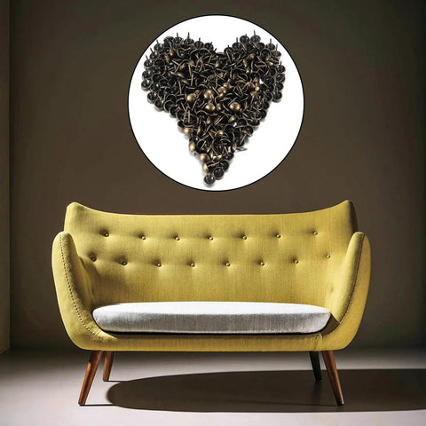 Premium 320 Piece Set Of Top Shelf Upholstery Tacks Featuring A Knockout Antique Brass Finish arranged in a heart shape above a yellow sofa.