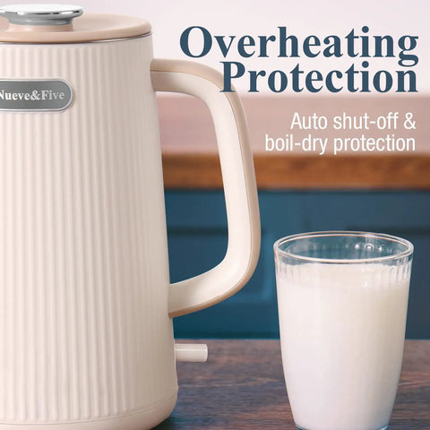 Side view of cream white Big 1.7L Electric Kettle For Tea And Coffee Lovers with a glass of milk, featuring auto shut-off