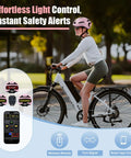 Woman wearing Women's LED Bike Helmet Go-To With Turn Signals And Brake Light, high visibility, on bicycle, app control display