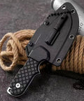 Close-up of Mini Survival Knife With Sheath, Back Clip Whistle, And Multi Tool Build on rope, EDC Ready for outdoor prep