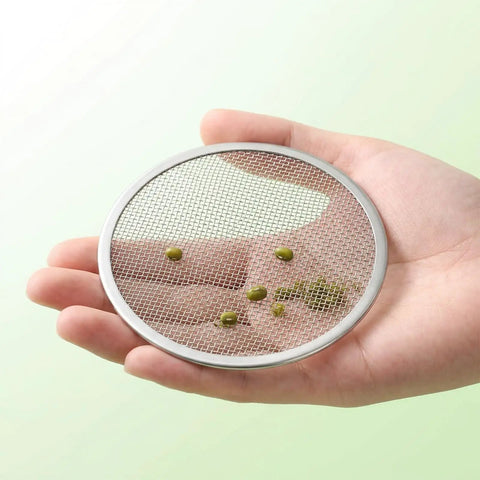 6 Pack Killer Sprouting Lids 304 Stainless Steel Fine Mesh Strainer Fits Wide Mouth Mason Jars in hand with seeds.