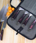 Chef Knife Roll Bag With Canvas Design Adjustable Shoulder Strap And Multiple Knife Slots displaying knives on table