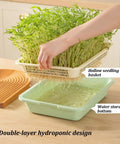 Hand lifting seedlings from Vertical Hydroponic Garden Tower With Wheels And Metal Shelf All In One Sprouts Growing Kit