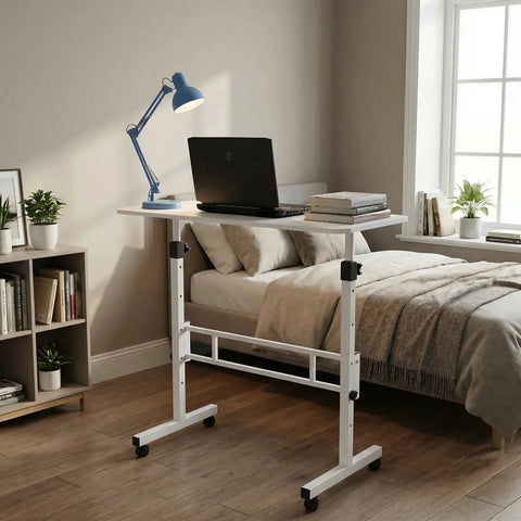 Rolling Ergonomic Standing Desk With Smooth Wheels Adjustable Height Desktop Laptop Workstation Level Up Your Remote Grind Straight Up, in a bedroom setting with a laptop.