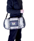 Person holding a Breathable Mesh Gear Bag Built Heavy Duty For Gym Beach Swim Scuba Sports Dive And Outdoor Use.
