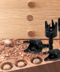 Eight Piece Wood Plug Cutter Set Hex Shank Straight Tapered Drill Bits with wood plugs and shavings on wood surface.