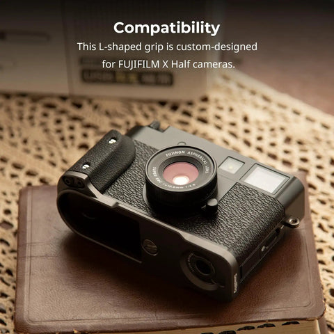 Fujifilm X Half L Shaped Grip With Built In Quick Release Plate For Arca attached to camera on table