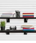 Six Pack Wooden Slatwall Shelves With Heavy Duty Metal Brackets For Home And Garage Organization, 24 By 12 Inch Slat Wall Storage, Space Saving Wall Shelves Kit showing two black shelves with books and decor