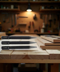 3 Piece Center Punch Set with 4 Inch High Carbon Steel Black Finish in workshop setting on wooden table.