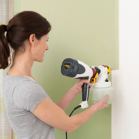 Person using PaintReady Handheld HVLP Sprayer With ISpray Nozzle For Medium Sized Projects Delivers Roller Like Finish On Walls And Ceilings
