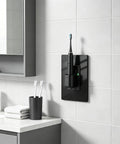 Sleek Black GFCI Outlet 15 Amp GFI Electrical Receptacle with toothbrush holder in modern bathroom setting.