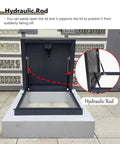 Tough As Nails Roof Hatch Cover With Beefy Hydraulic Lift Supports And Rust Resistant Aluminum Steel Dark Grey Flat Access Panel showing hydraulic rod detail, supporting lid.