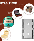 Iron Double Swing Door Hinges 4 Pack For Furniture And Screens Reliable And Sturdy shown next to boxes and travel bags