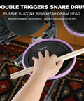 Electronic Drum Set For Beginners With Quiet Mesh Pads And Bluetooth, hand playing snare with purple silicone ring and sticks